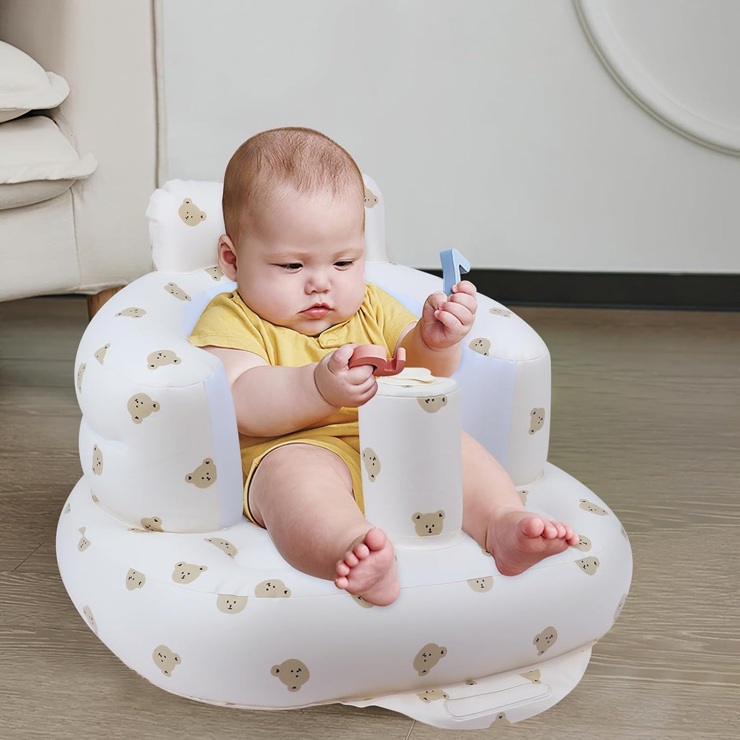 A suction-cupped inflatable baby seat suitable for babies aged 3 months and above, with an inbuilt air pump, for babies to sit on the floor.